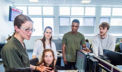 Academic staff talking to Criminology students