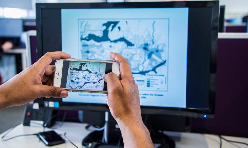 A student taking a photo of their screen during a Criminology workshop