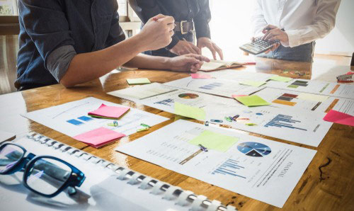 a group of people discussing research