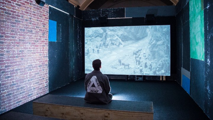 Student watching cinema screen 