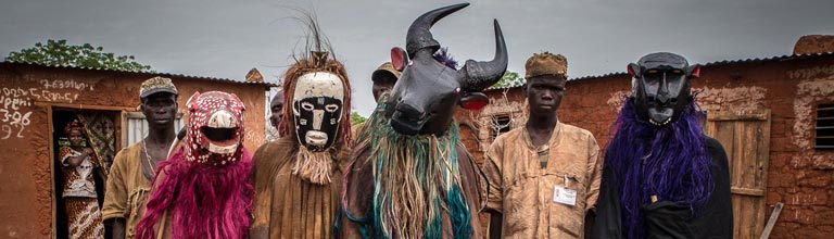 Men wearing tribal masks